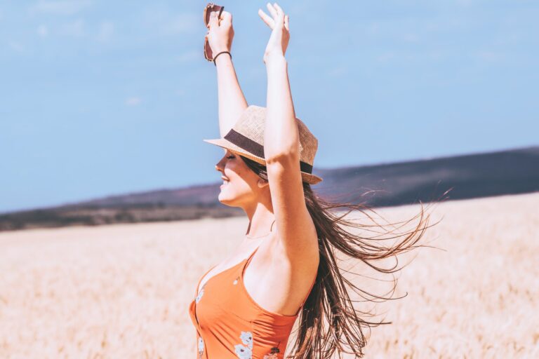 arms-raised-breeze-brunette-2577440